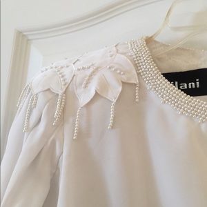 Ladies white blouse with enormous bead work